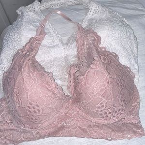 Two halter bralettes. White and pink is size L and white one is XL.
